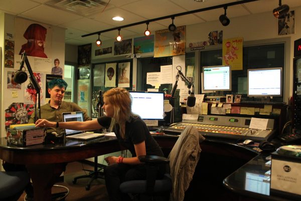 WRAS managers Alayna Fabricus (right) and Alex Jackson (left) discuss the semester’s reduced schedule due to GPB’s use of the analog station from 5 a.m. to 7 p.m. every day. Photo by Allyson Busch | The Signal