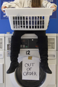 Students must wait to do their laundry since so many washers are out of order. PHOTO BY RUTH PANNILL | THE SIGNAL