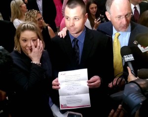 Janae Cox fights back tears as she and her husband, Brian Cox, display Georgia’s first medical cannabis card for their daughter Haleigh. Photo by | The Signal 
