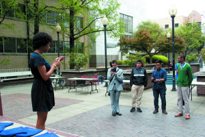 Nyomi Haynes announces last year's winning candidates for the 2015-2016 elections in Library Plaza Monday, April 13.  Nadia Deljou | The Signal archives 