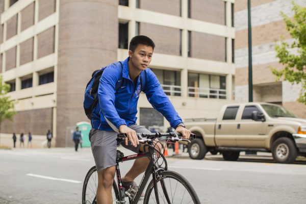 The amount of students choosing to ride their bikes to campus is increasing, but with the lack of bike lanes bikers have no choice but to share lanes with cars.  Photo by Jason Luong | The Signal archives