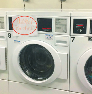 Students put their own signs on laundry room appliances. Photo by: Lauren Booker 