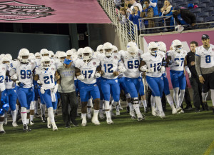 Panthers walk on field before Cure Bowl. Photo By | Jade Johnson