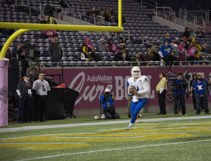 Nick Arbuckle in the end zone doing a drop back pass. Photo by Jade Johnson | The Signal 