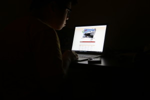 An internet addict vigorously browses the internet late at night. Photo by Jason Luong | The Signal 