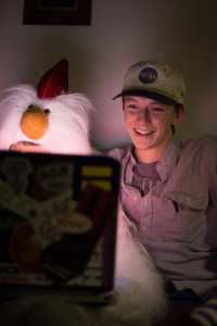 A furry and her “furry friend” enjoy watching videos on a laptop together.  Photo Illustration by Dayne Francis | The Signal 