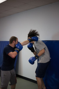 Charles Neugebauer and Chase Carroll go through contact drills, which helps improve a boxer’s defensive skills during a match. Photos by Dayne Francis | The Signal 