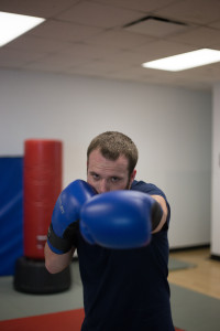 Georgia State University Boxing Club President Charles Neugebauer takes a jab in the Georgia State Recreational Center Photo by Dayne Francis | The Signal 