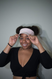 Taylor Taousana, founder of the brand Pussy Power, seeks to impact the world with her feminist clothing; such as caps that come in multiple colors inspired by her brand's color scheme pastel pink, black and white. Photo by Dayne Francis