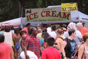 Participants enjoy homemade ice-cream and other sweet treats at the 2015 Atlanta Ice-cream Festival. 