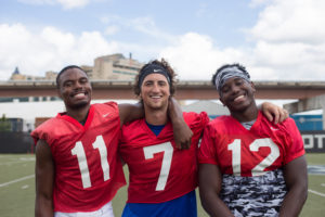 (left to right) Emeire Scaife, Aaron Winchester, and Conner Manning pose for a photo. The three quarterbacks battle for the top spot. Photo by Dayne Francis | The Signal