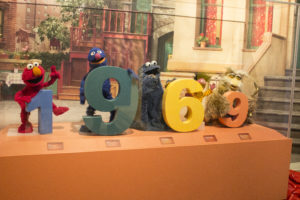 The cast of Sesame Street posing in front of 1969 sign, the year the show first premiered on television.  Photos by Lahar Samantarai | The Signal 