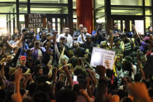 Black Lives Matter protestors gathered at the Atlanta Police Department headquarters on Friday night to voice their anger over the killings of Keith Lamont Scott, Terence Crutcher and other victims of police brutality. Photo by Lahar Samantarai | The Signal 