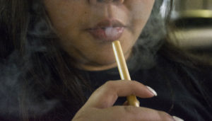 Some Georgia State students choose to smoke e-cigarettes in hopes of quitting their nicotine habit.  Photo Illustration by Jade Johnson | The Signal 