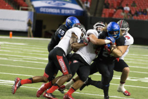 Georgia State running back Kyler Neal is taken down by the Ball State defense. Georgia Dome, Sept. 2, 2016 Photo By Dayne Francis | The Signal