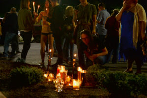 Atlanta residents gather and light candles in memory of “Murder Kroger”, located off Ponce de Leon Avenue. Photo by Christina Maxouris | The Signal 