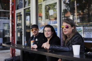 The Satanic Temple members ( from left to right) Cody Waters, Fred Mephisto, and Rob Thompson hold their monthly meetings at Java Lord, a coffee shop in Little Five Points. Photo by Dayne Francis | The Signal 