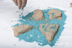 Kinetic sand in the shape of an archipelago.  Photo by Dylan Jones | The Signal  