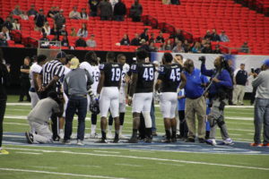 Georgia State and Georgia Southern meet before the kick off. Photo By Woody Bass | The Signal