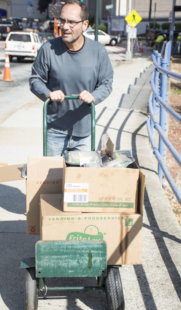 Georgia State student Rudy Schlosser collects leftover food from the Panther Club every Friday and wheels them down on a cart to The Shrine of Immaculate Conception, a catholic church near Georgia State’s campus. 