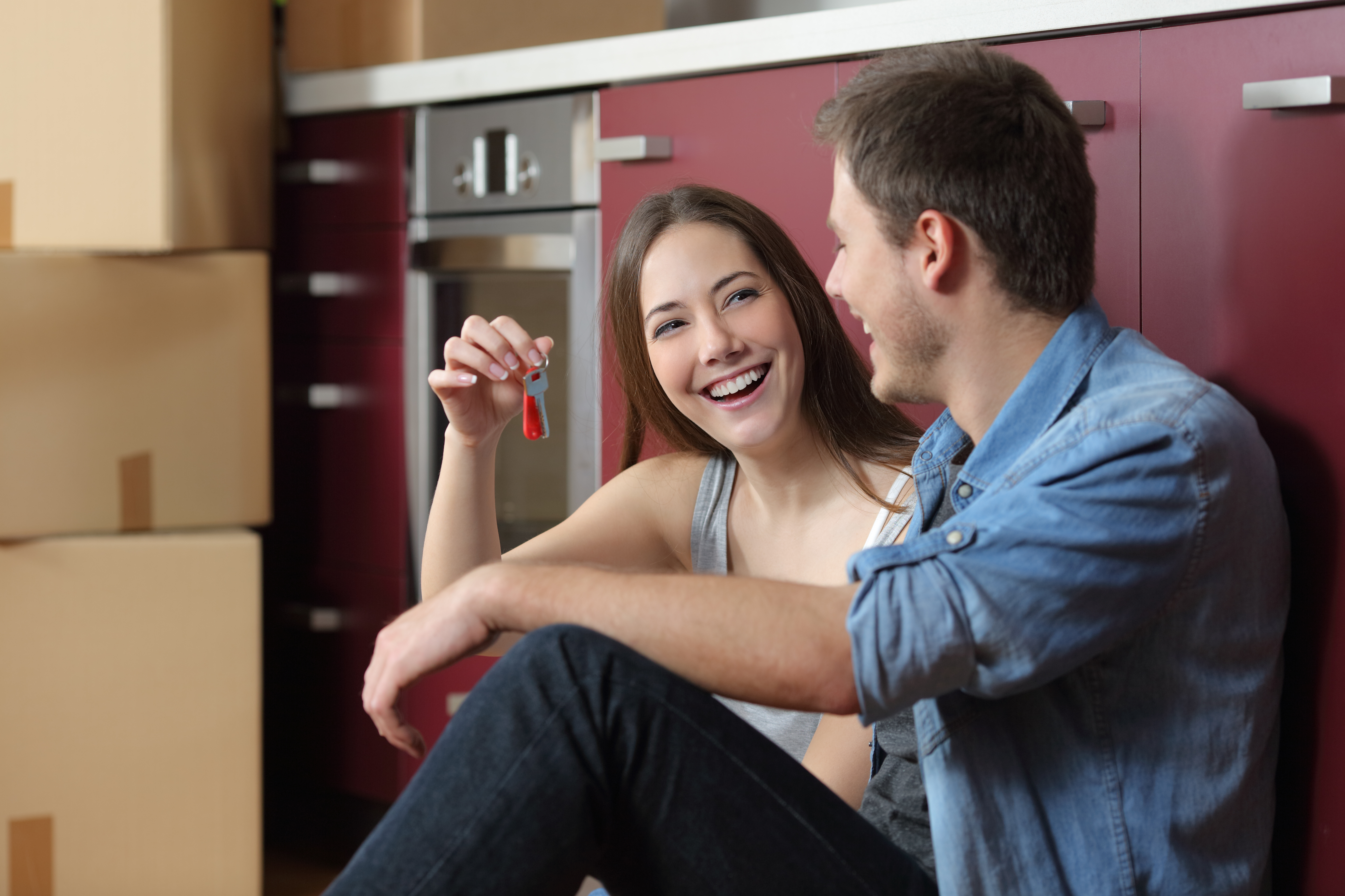 Happy tenants showing new home keys